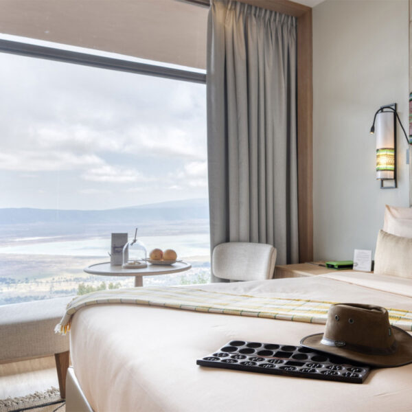 Cozy bedroom at Ngorongoro Lodge Meliá Collection offering premium crater accommodation