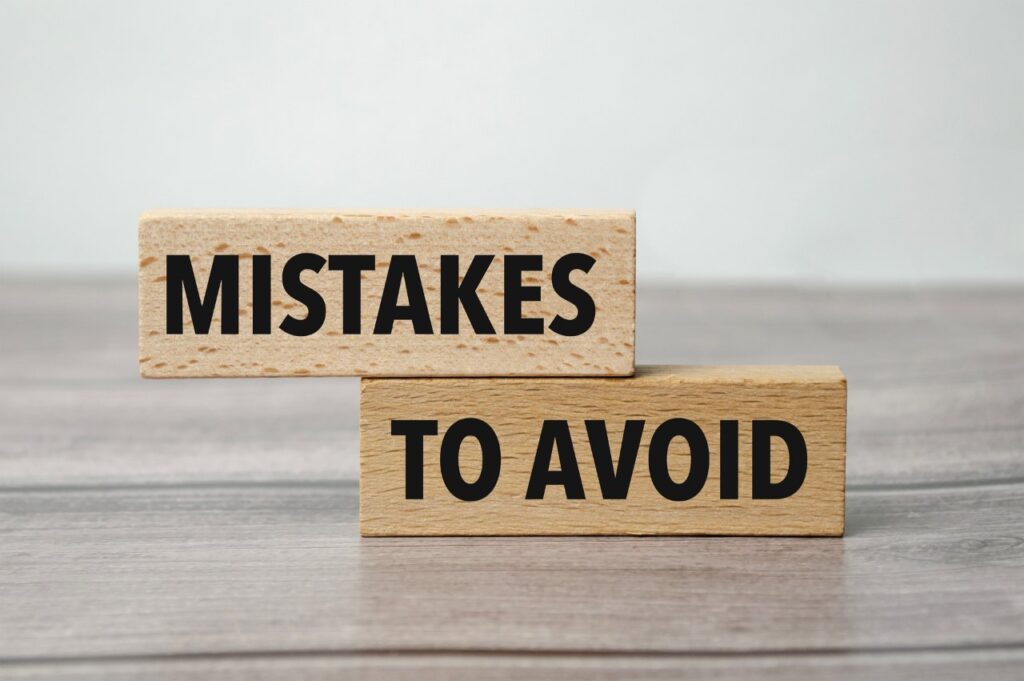 words mistakes to avoid written on wooden blocks