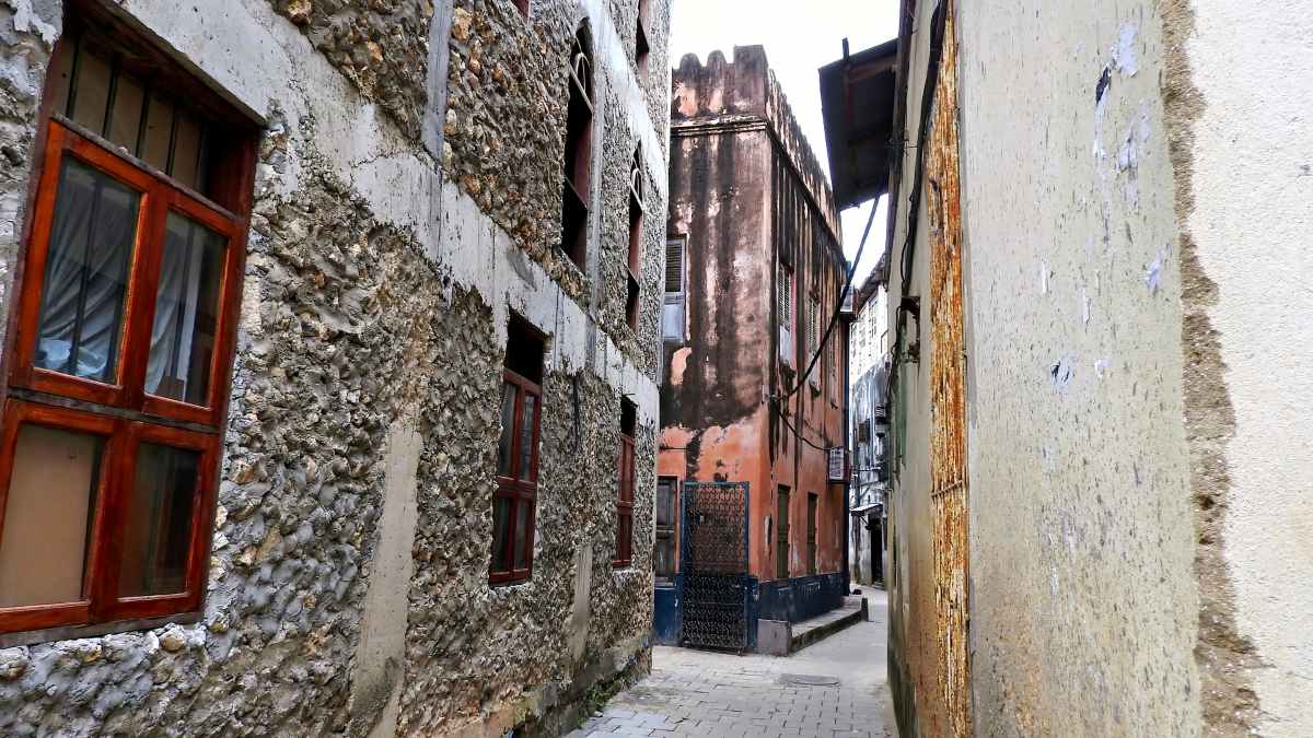 Street canyon with old houses in the streets of Stone Town in Zanzibar, Tanzania